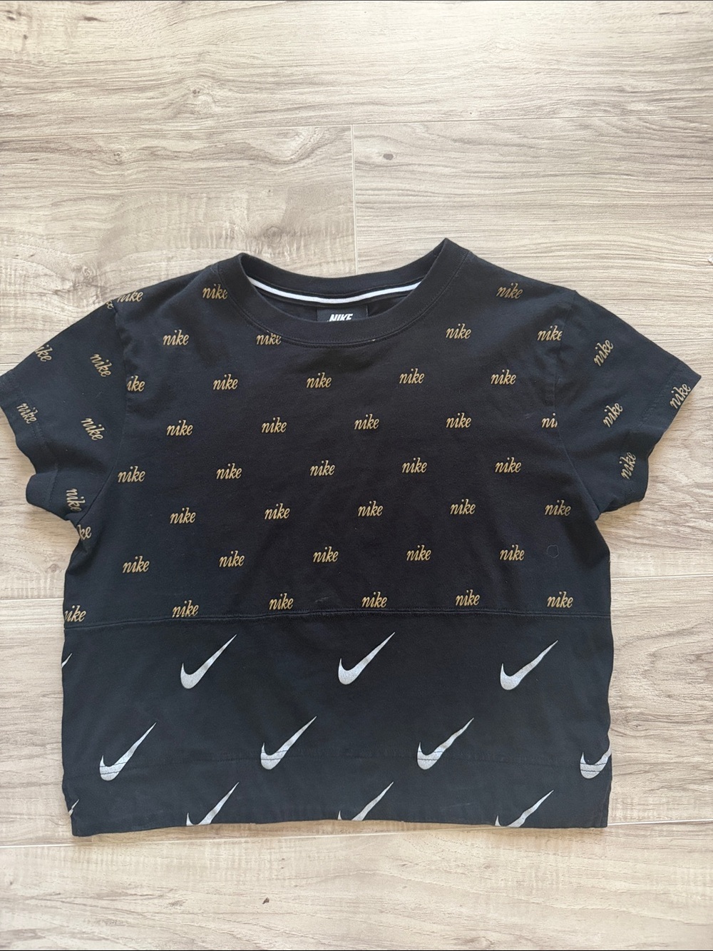 Nike Black Crop Top with Gold Repeat Logo and White Swoosh